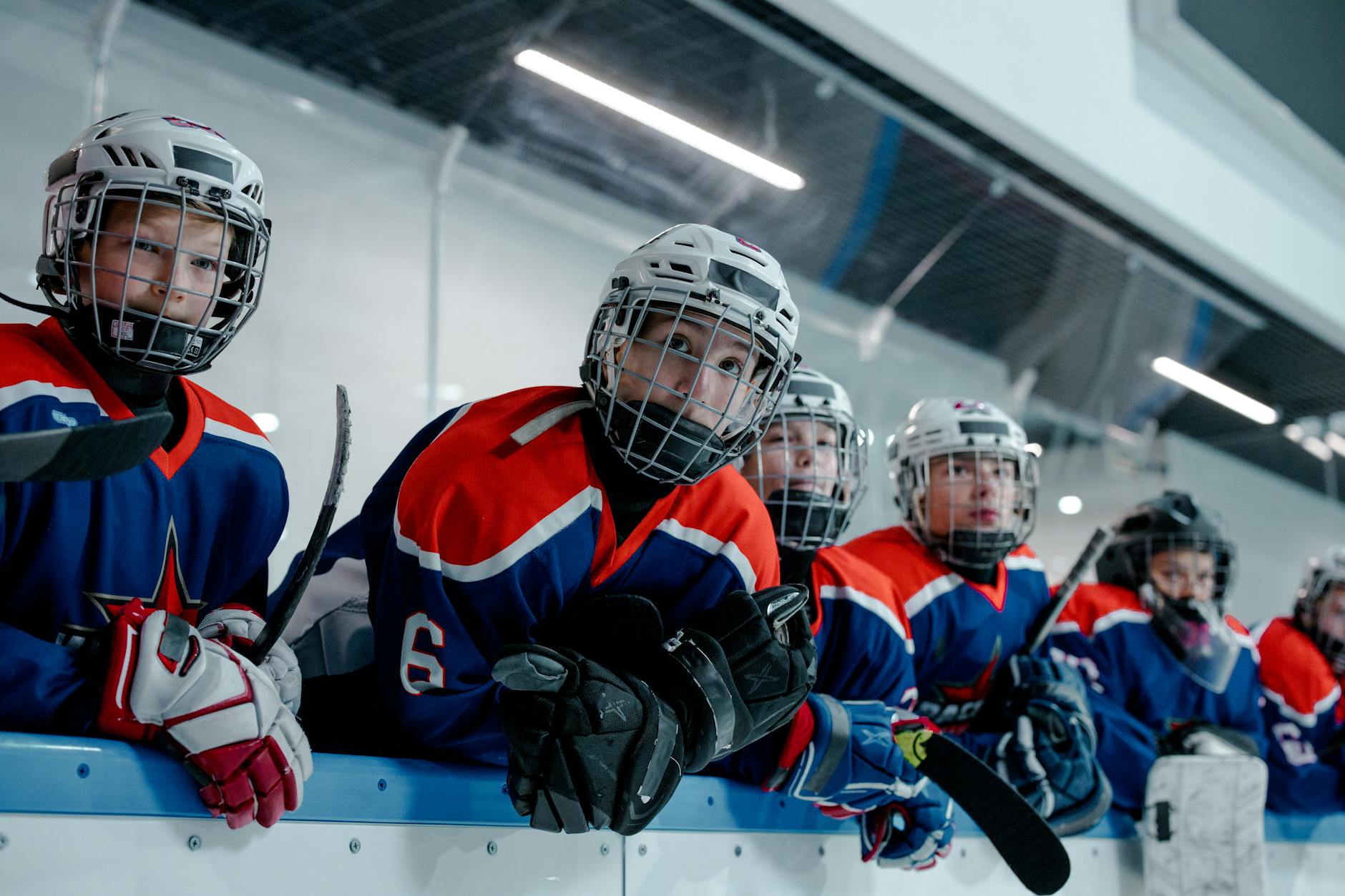 men in blue and red hockey uniforms