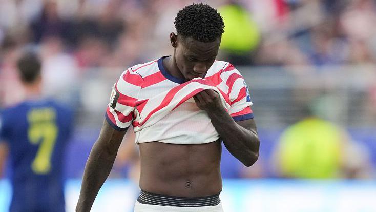 USA Advances to Face Belgium, but Balogun’s Red Card Casts Shadow Over Campaign